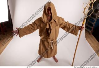 18 2019 01 JOEL ADAMSON MONK STANDING POSE WITH A…